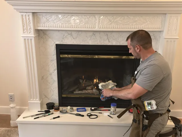 Madison Chimney Sweep performing fireplace maintenance in Madison, CT