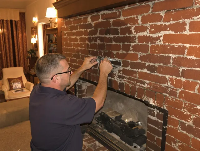 Madison Chimney Sweep expert fixing a fireplace in Madison, CT